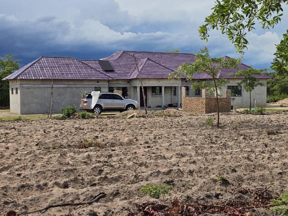 The Nyaluwe farmhouse, home of the farming family in Samwiri Village, Bulala